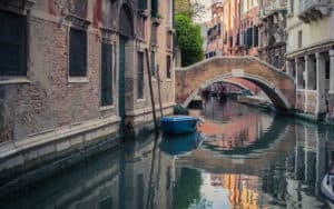 Rick Steves overdosing on Venice Italy with image of canal and gondola Image