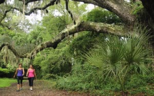 Two women walking at Hilton Head Resort, exercise to achieve the perfect post-pandemic body Image