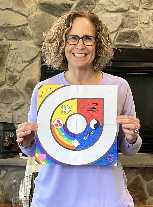 Janet Blaton with kolam and other multicultural symbols