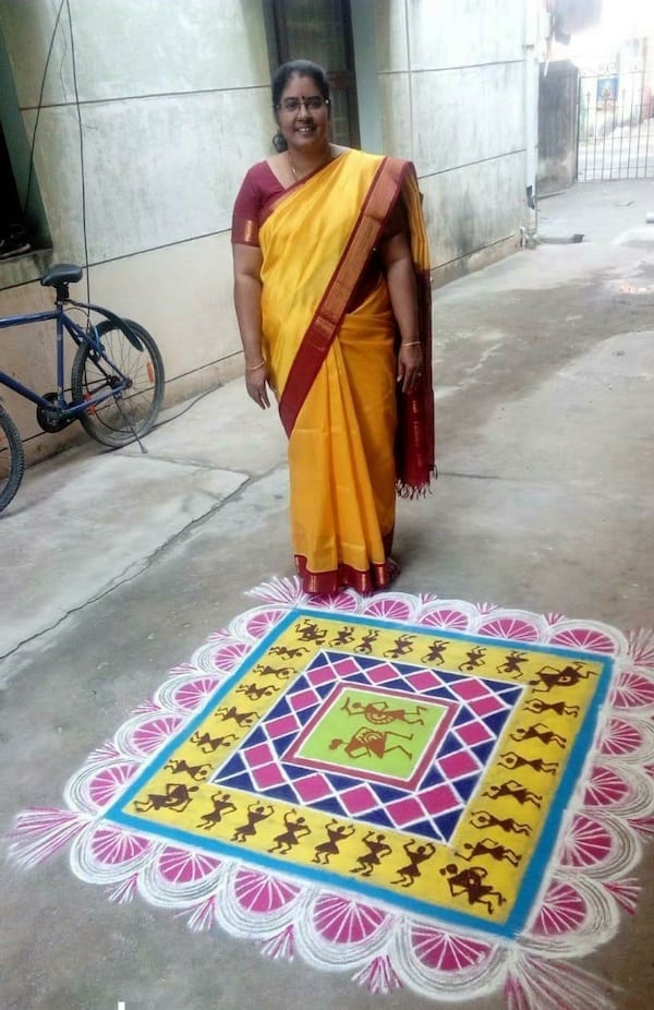 Indian woman on street with kolam and native American looking figures