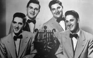 1951 quartet with trophy. Schmitt Brothers barbershop quartet Image