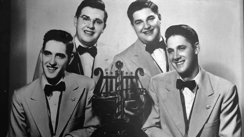 1951 quartet with trophy. Schmitt Brothers barbershop quartet Image