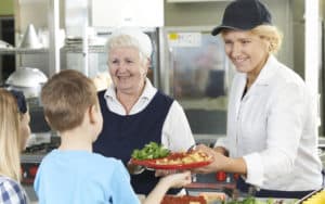 Lunch ladies at a school cafeteria Image