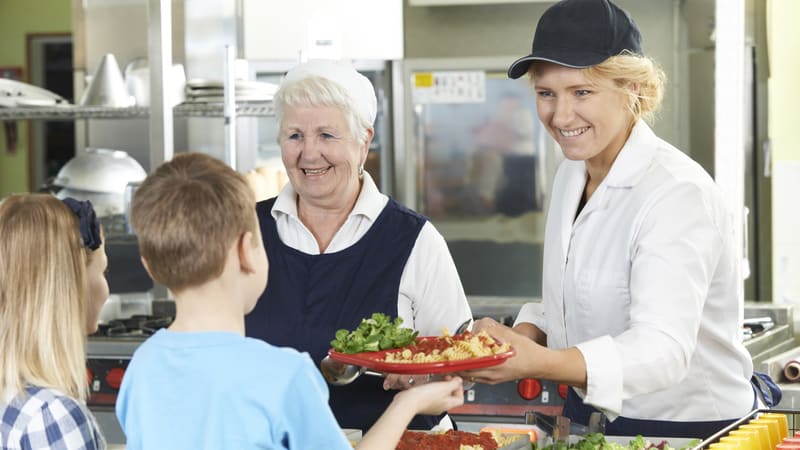 Lunch ladies at a school cafeteria