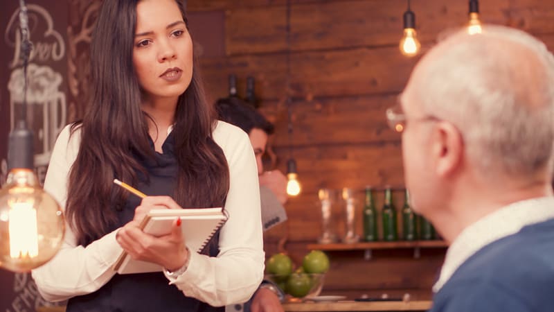 Older man getting "sweetied" by waitress