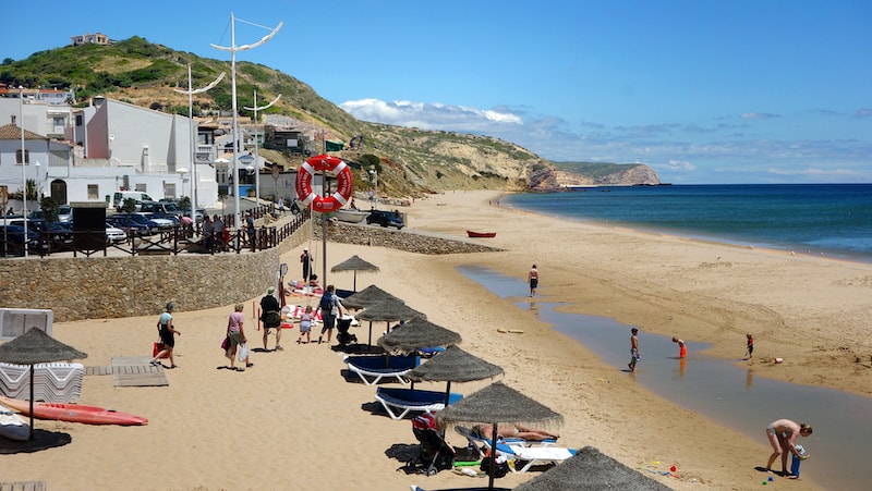 Salema’s fishermen share their beach with travelers. CREDIT: Rick Steves. For article on Tradition and Tourism Coexist in Salema