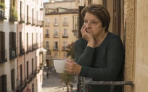 Senior woman on balcony gets no appreciation Image