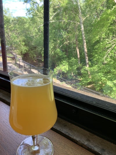A hazy IPA and the view from a window table at Selvedge Brewing at The Wool Factory