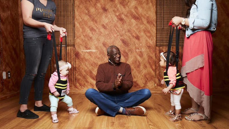 Jeffrey Nash demonstrating his Juppy invention, aiding adults as children learn to walk. For article on "Tips for Starting Again"