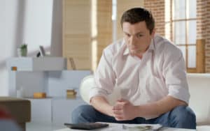 Man conflicted about whether or not to offer compassion for his gross relative Image