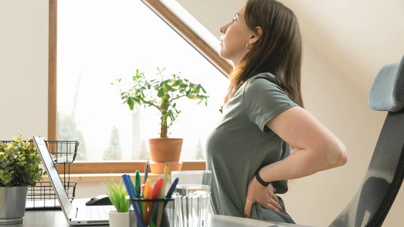 Woman trying to stay active while working from home Image