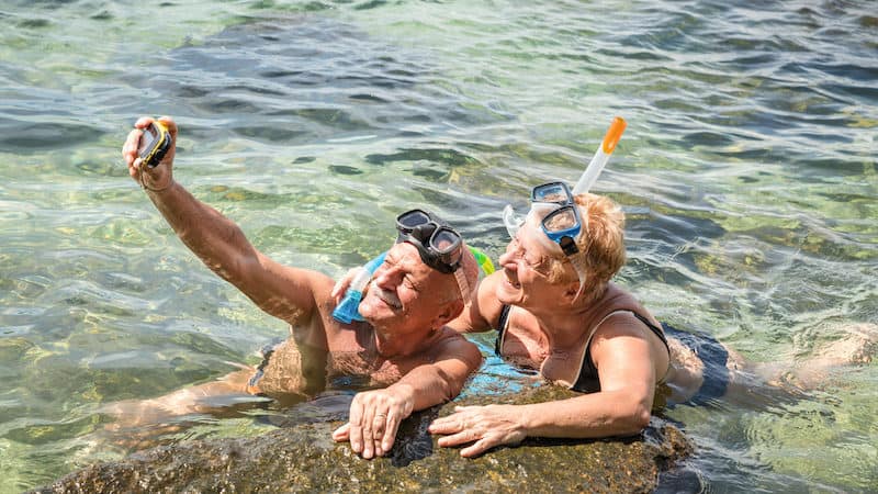senior snorkelers. Credit: mirko vitali dreamstime. For article on Boomers Financing Post-COVID Travel Image