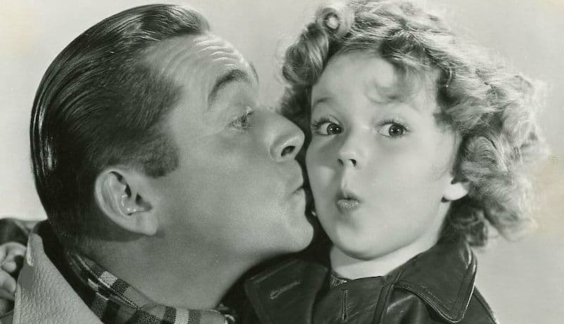 James Dunn and Shirley Temple publicity photo for Bright Eyes-front (cropped). Fox Film Corp publicity photo, Public domain, via Wikimedia Commons - for the famous kids trivia quiz