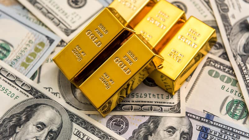 gold bullion ben franklins Roman Romaniuk Dreamstime. For article on family dinnertime discussion in 1971 Image