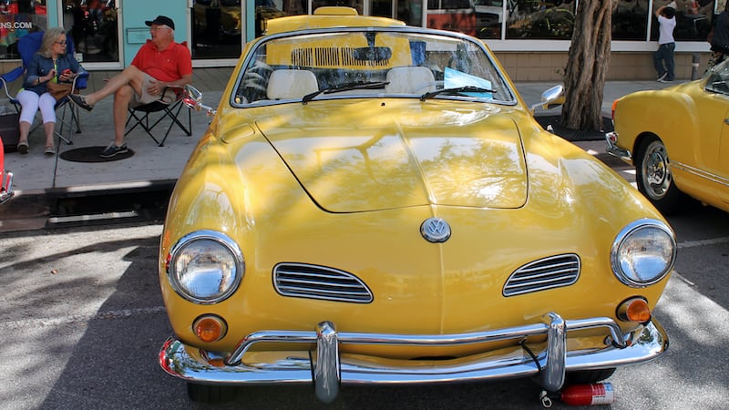 Vintage yellow VW Karmann Ghia cabriolet: for A Karmann Ghia and a boxing match