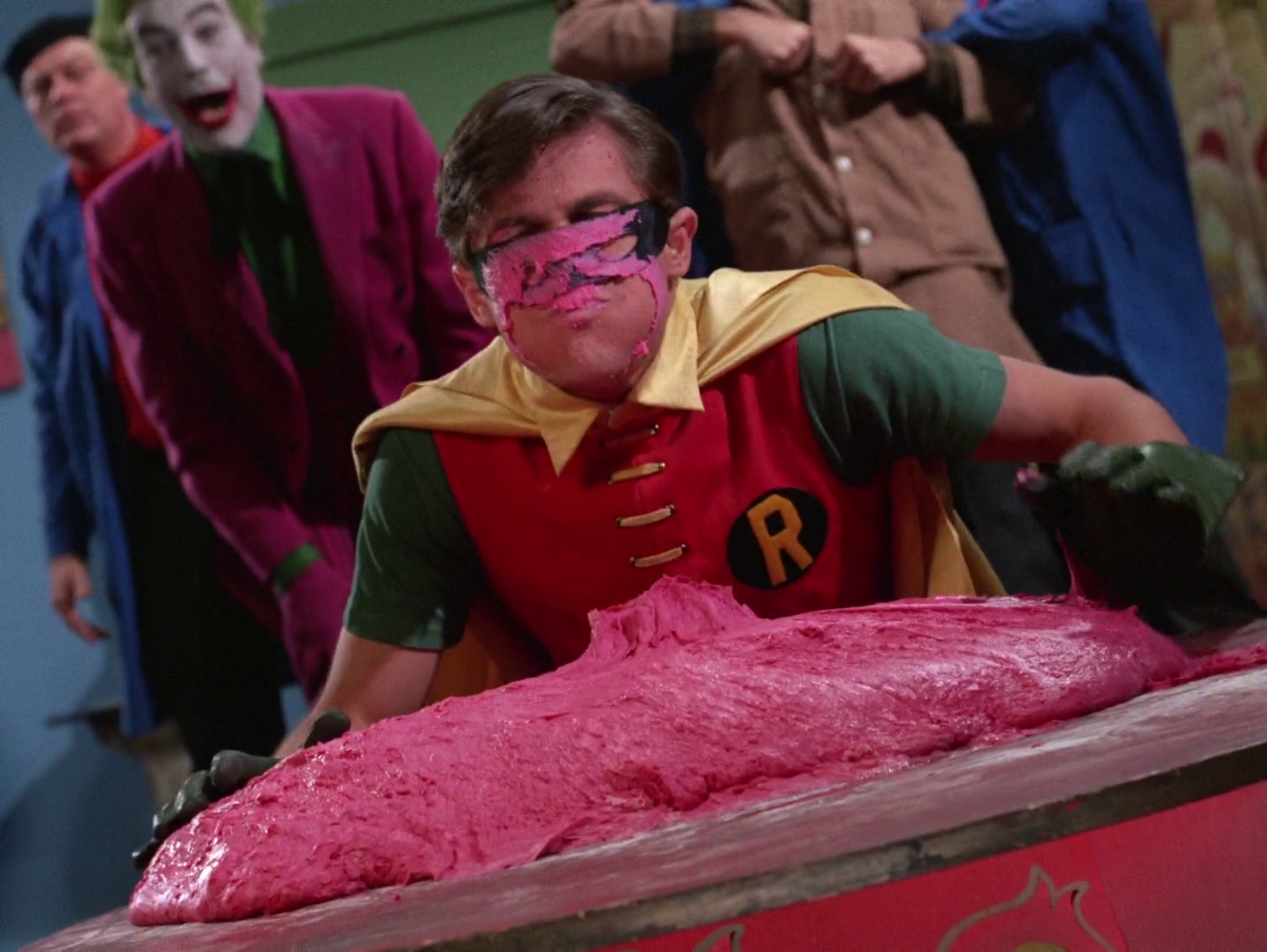 Robin's face after it landed in the Joker's glob of pink clay