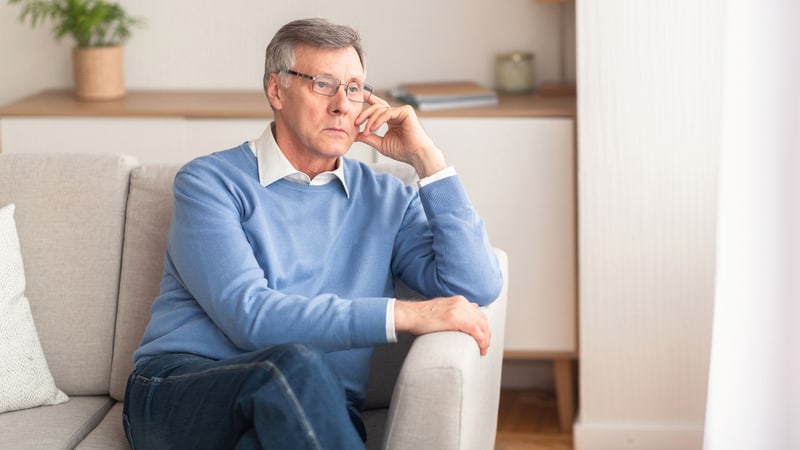 Senior man thinking about his Alzheimer's diagnosis