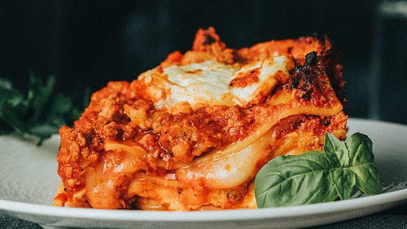 Meat lasagna from Dinner in the Field for article on supporting independent food vendors near and far