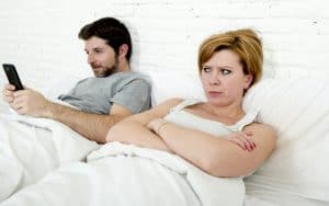 Insecure wife doesn't like all that texting! Image