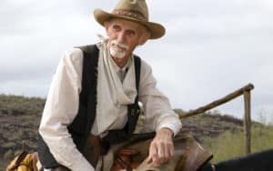 A rancher overlooks his herd Image