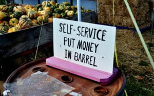 self service sign at a pumpkin farm stand. Photo by Lei Xu dreamstime. For article, The honor system still works Image