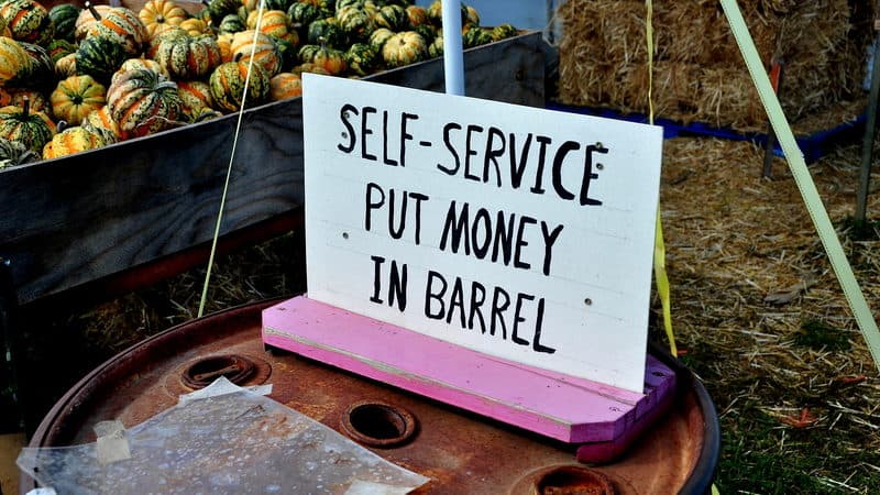 self service sign at a pumpkin farm stand. Photo by Lei Xu dreamstime. For article, The honor system still works Image