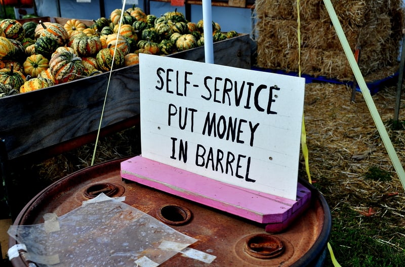 self service sign at a pumpkin farm stand. Photo by Lei Xu dreamstime. For article, The honor system still works