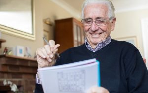 senior man doing puzzle. Image credit Katie Nesling Dreamstime.com Image