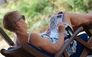 senior woman doing puzzle Rozenn Leard Dreamstime.com Image