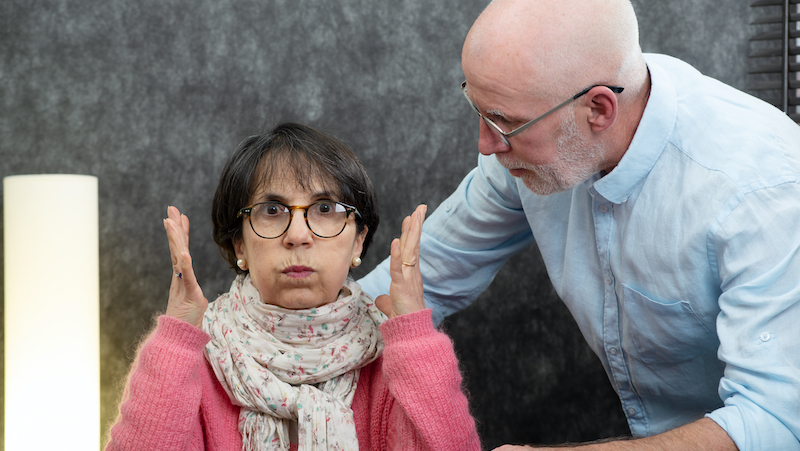 An elder couple with an exasperated woman. For article, Late-Life Romance with a Crook