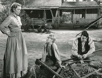 Jane Wyman, Claude Jarman Jr., and Gregory Peck on Florida farm set for The Yearling - MGM
