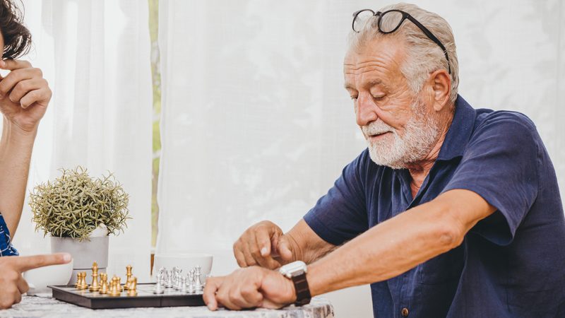 Man playing chess Photo Korn Vitthayanukarun Dreamstime2. For use with puzzles, boggle, games, etc. Image