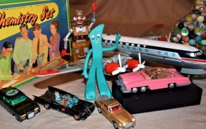 Some of the author's childhood Christmas toys that survived over the decades including marbles, a Zeroid robot, die-cast cars, a Gumby figure, chemistry set, and a tin aircraft - photo Nick Thomas. For article on Memories of Christmas Toys Past Image