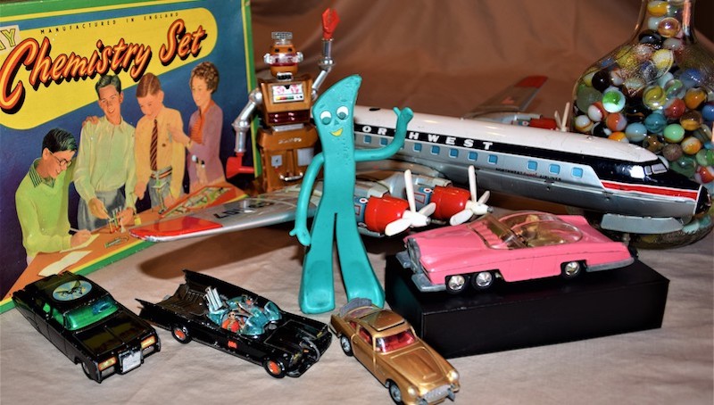 Some of the author's childhood Christmas toys that survived over the decades including marbles, a Zeroid robot, die-cast cars, a Gumby figure, chemistry set, and a tin aircraft - photo Nick Thomas. For article on Memories of Christmas Toys Past