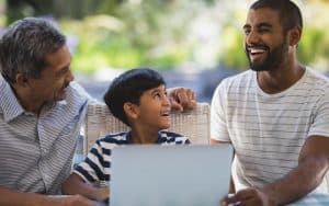 Three generations on laptop Photo by Wavebreakmedia Ltd Dreamstime. Doing puzzles or other fun activities. Image