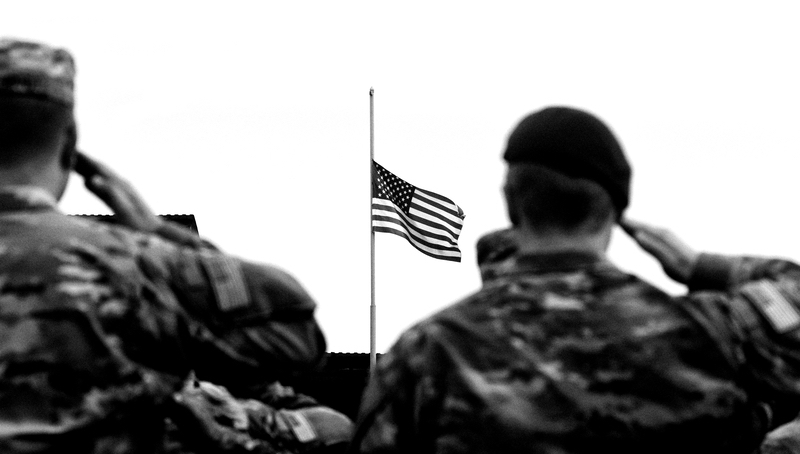 military saluting flag Photo Bumbleedee Dreamstime. For article on Veterans Day 2021 in Richmond