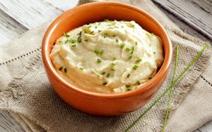 mashed cauliflower in a bowl. For article on healthy vegetarian Thanksgiving dinner tips. Photo from Premium Health Image
