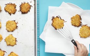 Latkes are commonly enjoyed during the Jewish holiday. For article on America's Test Kitchen's recipe for oven-baked latkes Image