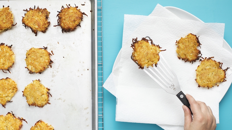 Latkes are commonly enjoyed during the Jewish holiday. For article on America's Test Kitchen's recipe for oven-baked latkes