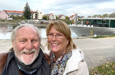 Writer Peggy Sijswerda and her husband, Peter, in front of the cruise ship in Regensburg on the Danube River.