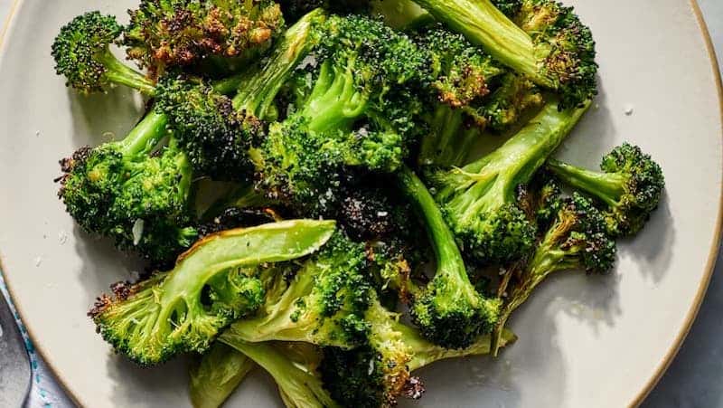 For article on air fryer broccoli: Air-fry slender stalks of broccoli for a tender and crispy-tipped side dish to serve all year long.