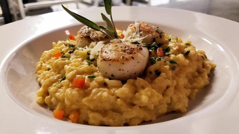 Scallops over Pumpkin Sage Risotto (with some Parmesan to make it nice and creamy) at White Dog Bistro in Mathews, Virginia