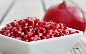 The mega-superfood seeds of pomegranates can help you fight off colds, boost your heart health, and even give you more energy at the gym. For article on 6 pomegranate health benefits. Image