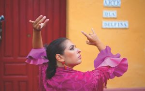 Andalucía celebrates life with soul and with passion. Here, a woman dances the flamenco. Image