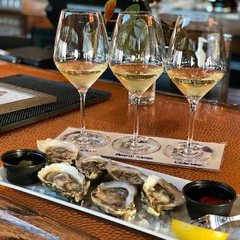 wine and oysters at Trio OBX