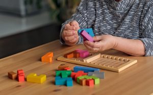 Woman doing three-dimensional Brain Training puzzle Photo Elvira Koneva Dreamstime Image
