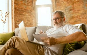 man with laptop doing a puzzle. Photo by volodymyr melnyk dreamstime Image