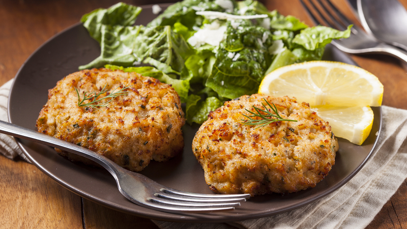 2 crab cakes on a plate with lemon and a mixed green salad. Photo by Bhofack2 Dreamstime. Richmond food and travel writer Steve Cook takes readers to another classic restaurant in Richmond, Virginia: Sam Miller’s Oyster Bar and Seafood Restaurant ... yes, seafood, plus hand-cut steaks, French onion soup, and so much more. All in a warm, cozy setting.