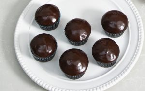 America’s Test Kitchen brings us their tested recipe for super-chocolaty cupcakes, made with cocoa powder and crowned with a delicious chocolate glaze. This is a great shareable dessert for chocolate lovers. Image