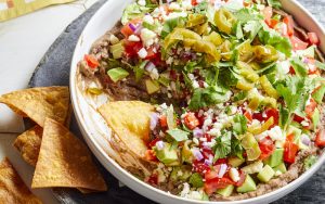 Loaded 7-layer black bean dip from EatingWell. This dip is easy to make and oh-so flavorful. Image